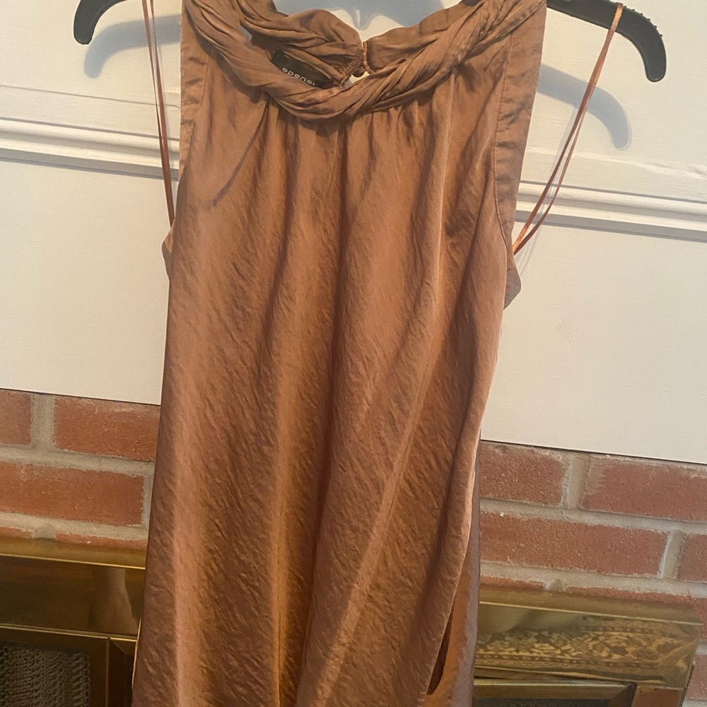 Silky blouse with a rolled neck line. Size L